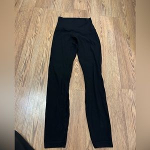 Women’s black Lululemon leggings, size 0